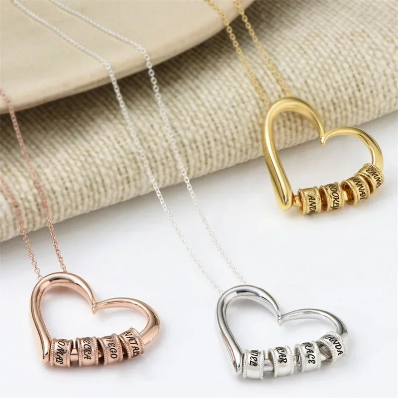 Three personalized heart necklaces for women in rose gold, gold, and silver with custom engravings
