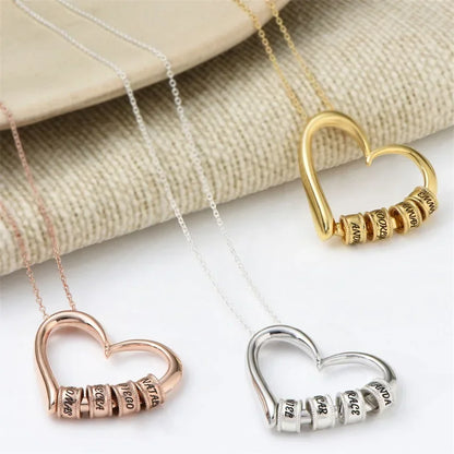 Three personalized heart necklaces for women in rose gold, gold, and silver with custom engravings