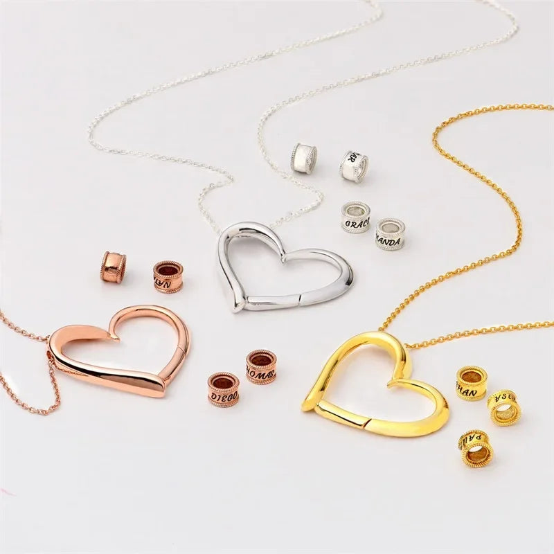 Anthriscus Vulgare personalized heart necklace for women with assorted charm beads in gold, silver, and rose gold